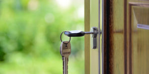 House keys resting in door lock