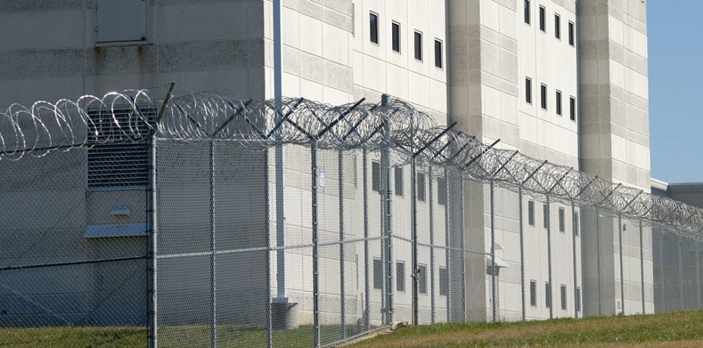 Barbwire fence in front of prison