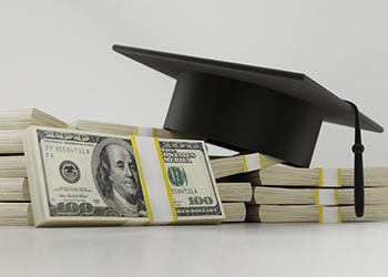 Picture of money and a college graduation cap