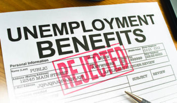 Image is a paper unemployment benefits application form, with a large red "REJECTED" stamped across it.